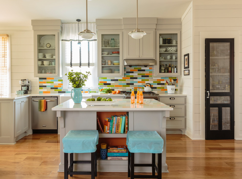 Kitchen - mid-sized transitional l-shaped medium tone wood floor kitchen idea in Little Rock with a farmhouse sink, shaker cabinets, gray cabinets, multicolored backsplash, stainless steel appliances and an island