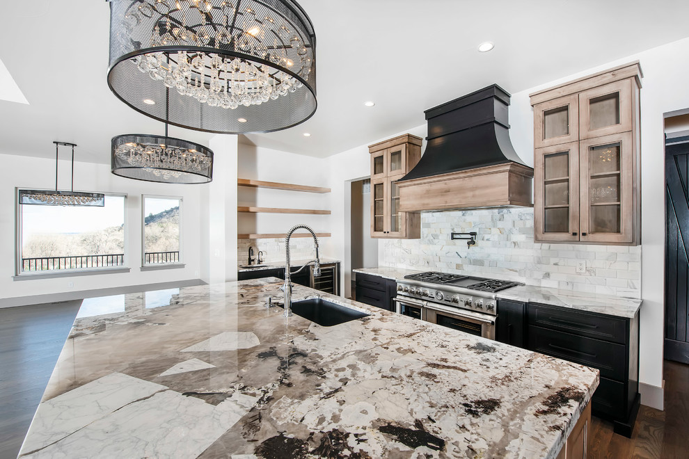Inspiration for a large contemporary kitchen in Denver with black cabinets, stainless steel appliances and an island.