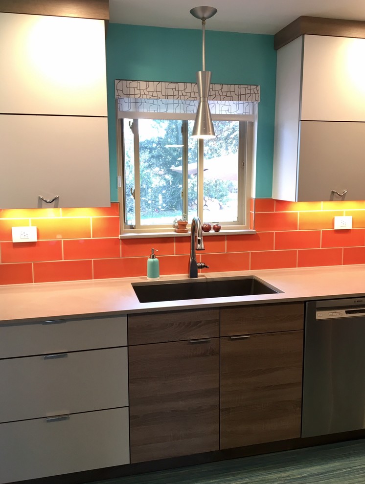 Photo of a small retro galley enclosed kitchen in Other with a single-bowl sink, flat-panel cabinets, grey cabinets, engineered stone countertops, orange splashback, ceramic splashback, stainless steel appliances, lino flooring, no island and turquoise floors.