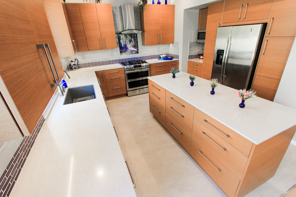Inspiration for a modern kitchen in San Diego with flat-panel cabinets, engineered stone countertops and an island.
