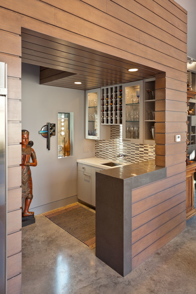 Contemporary kitchen in Houston with mirror splashback.