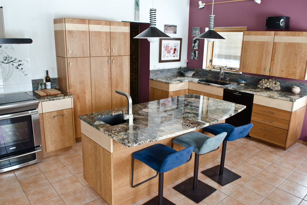 Transitional ceramic tile kitchen photo in New York with light wood cabinets, granite countertops, multicolored backsplash, black appliances and an island