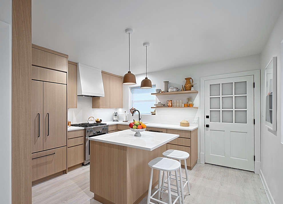Small trendy u-shaped light wood floor and gray floor enclosed kitchen photo in Chicago with an undermount sink, flat-panel cabinets, light wood cabinets, quartz countertops, white backsplash, stone slab backsplash, stainless steel appliances, an island and white countertops
