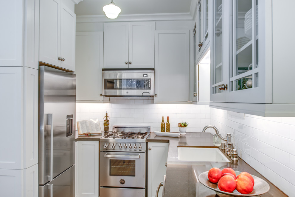 Small trendy galley light wood floor kitchen pantry photo in San Francisco with an undermount sink, shaker cabinets, white cabinets, quartz countertops, brown backsplash, ceramic backsplash, stainless steel appliances and no island