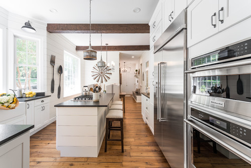 Transitional Farmhouse White Kitchen Cabinets with White Paneled Island and Black Countertop