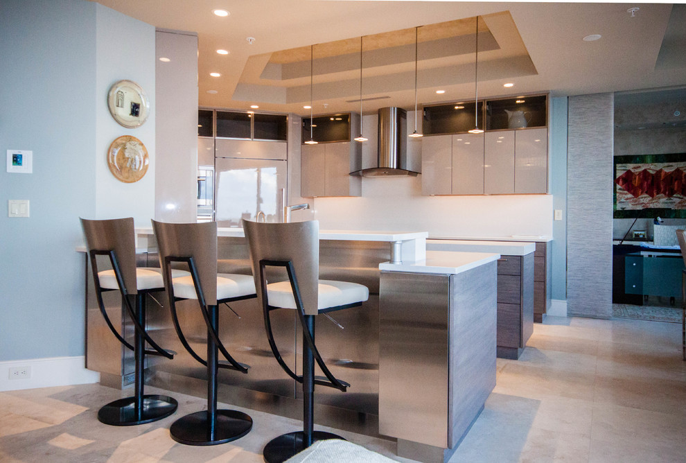 Inspiration for a mid-sized modern u-shaped eat-in kitchen remodel in Miami with flat-panel cabinets, light wood cabinets, quartz countertops, stainless steel appliances and an island