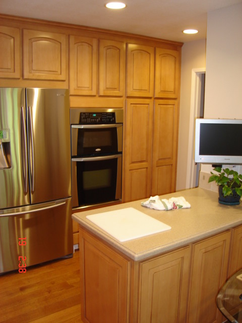 This is an example of a medium sized classic l-shaped kitchen/diner in San Francisco with raised-panel cabinets, white cabinets, granite worktops and stainless steel appliances.