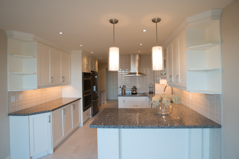 Medium sized contemporary l-shaped enclosed kitchen in Toronto with a submerged sink, shaker cabinets, white cabinets, quartz worktops, beige splashback, ceramic splashback, stainless steel appliances and porcelain flooring.