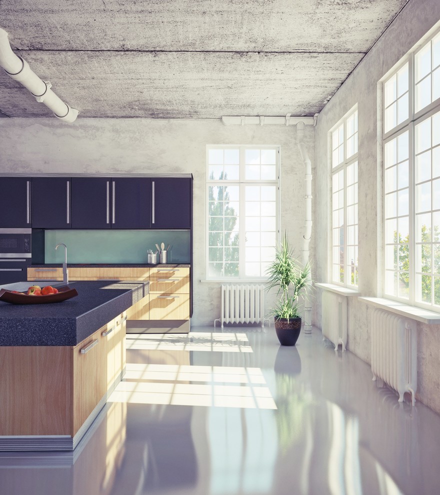 Example of a small minimalist u-shaped concrete floor eat-in kitchen design in Boston with a drop-in sink, flat-panel cabinets, black cabinets, granite countertops, green backsplash, ceramic backsplash, stainless steel appliances and an island