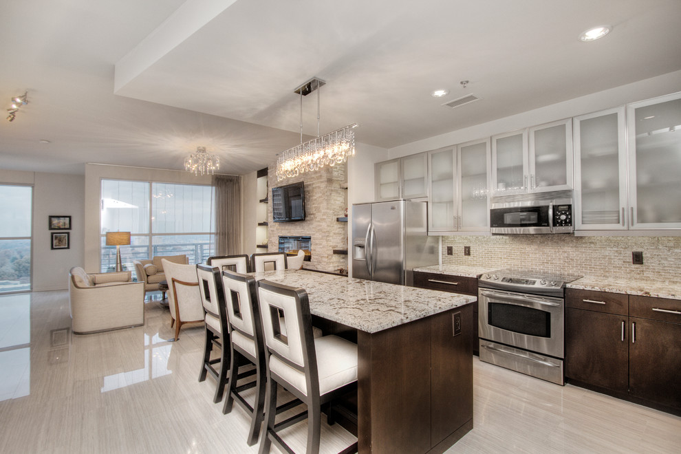 Mid-sized minimalist l-shaped porcelain tile and gray floor open concept kitchen photo in Miami with an undermount sink, glass-front cabinets, dark wood cabinets, granite countertops, metallic backsplash, mosaic tile backsplash, stainless steel appliances, an island and multicolored countertops