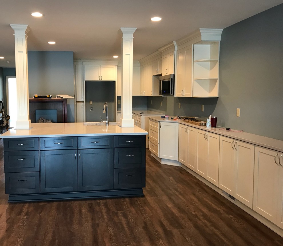 Photo of a traditional kitchen in Cleveland with shaker cabinets and an island.