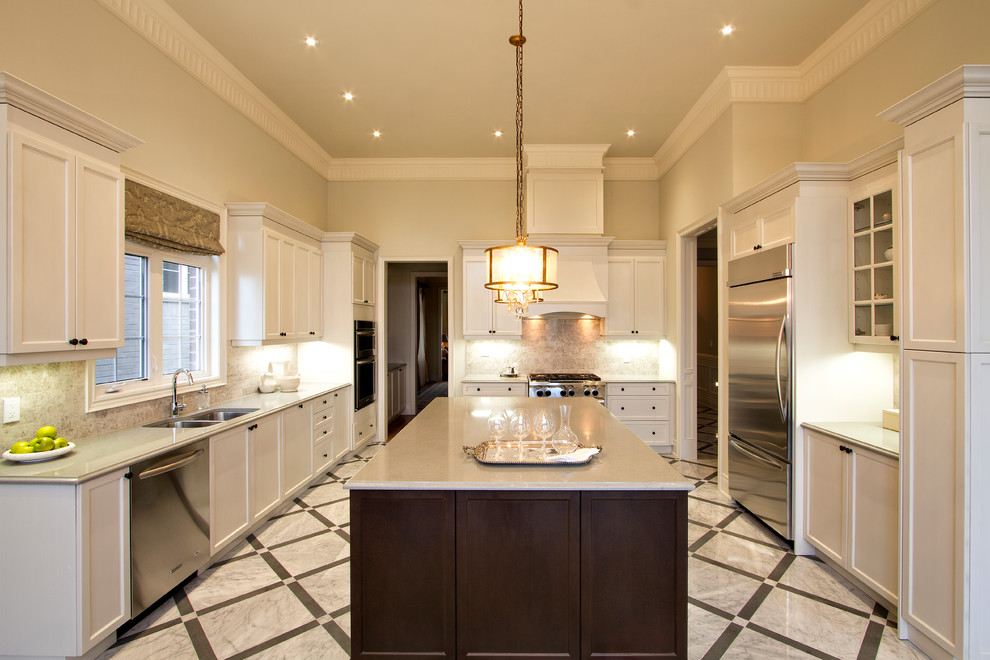 Enclosed kitchen - large transitional u-shaped marble floor and white floor enclosed kitchen idea in Detroit with a double-bowl sink, shaker cabinets, white cabinets, quartz countertops, beige backsplash, travertine backsplash, stainless steel appliances and an island