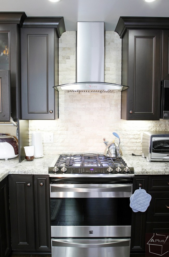 Mid-sized trendy l-shaped dark wood floor eat-in kitchen photo in Orange County with a double-bowl sink, recessed-panel cabinets, dark wood cabinets, granite countertops, gray backsplash, porcelain backsplash, stainless steel appliances and a peninsula