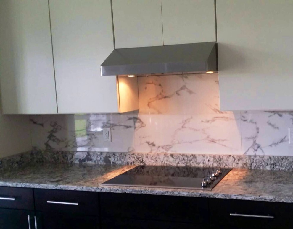 Inspiration for a small contemporary single-wall ceramic tile eat-in kitchen remodel in Jacksonville with flat-panel cabinets, multicolored backsplash, porcelain backsplash and an island
