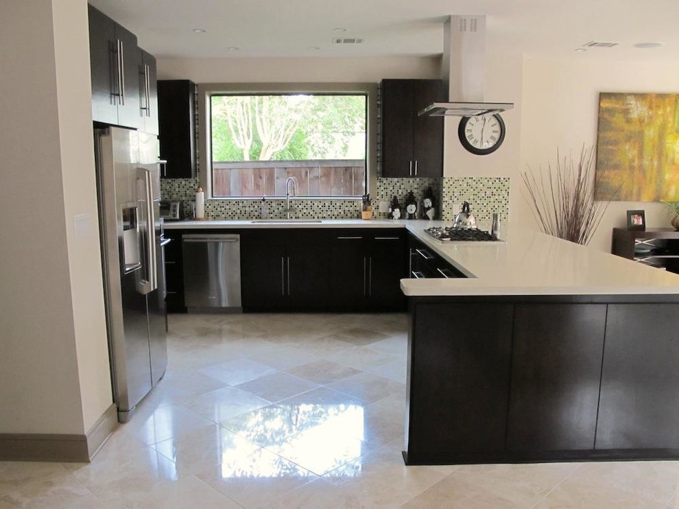 Inspiration for a large modern u-shaped travertine floor kitchen remodel in New York with an undermount sink, flat-panel cabinets, black cabinets, solid surface countertops, multicolored backsplash, mosaic tile backsplash, stainless steel appliances and an island