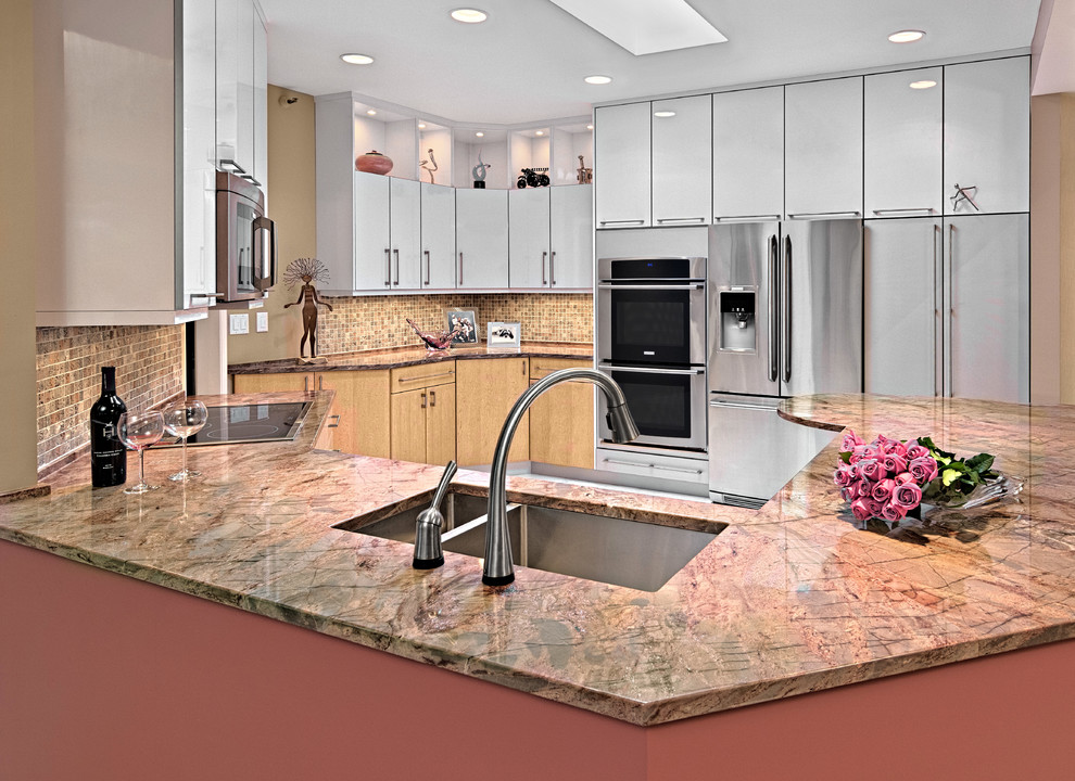 Example of a mid-sized trendy u-shaped porcelain tile open concept kitchen design in Minneapolis with an undermount sink, flat-panel cabinets, light wood cabinets, granite countertops, multicolored backsplash, mosaic tile backsplash, stainless steel appliances and a peninsula