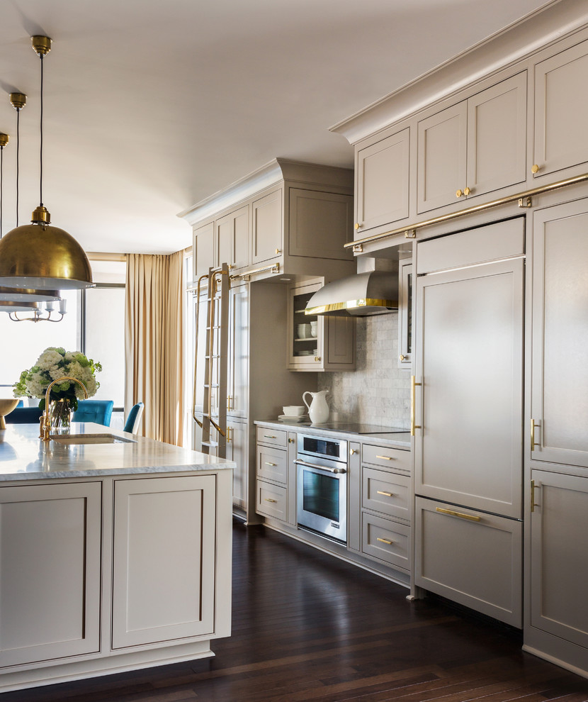 Transitional kitchen photo in Little Rock with gray cabinets, white backsplash, stone tile backsplash and an island