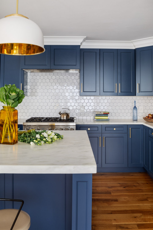 Light blue cabinetry kitchen with patterned tile floors in a