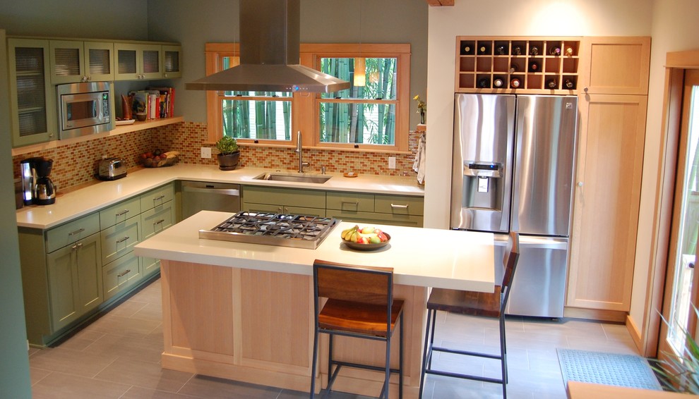 Kitchen - craftsman u-shaped kitchen idea in Portland with mosaic tile backsplash, stainless steel appliances, multicolored backsplash, green cabinets, an undermount sink, shaker cabinets, quartz countertops and an island