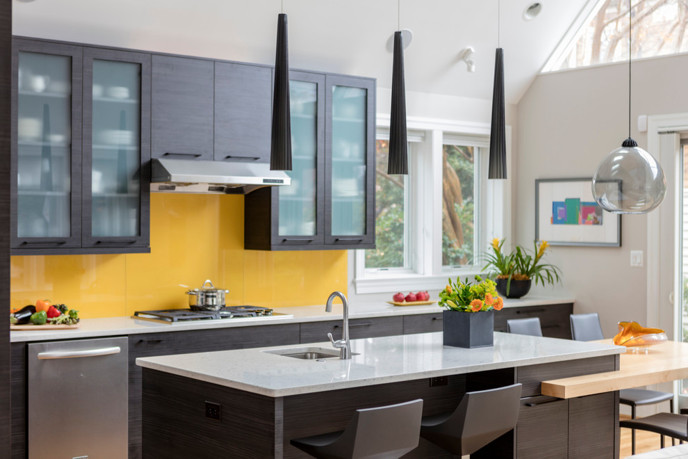 Open concept kitchen - large contemporary l-shaped light wood floor open concept kitchen idea in DC Metro with an undermount sink, flat-panel cabinets, black cabinets, quartz countertops, glass sheet backsplash, stainless steel appliances, an island and yellow backsplash
