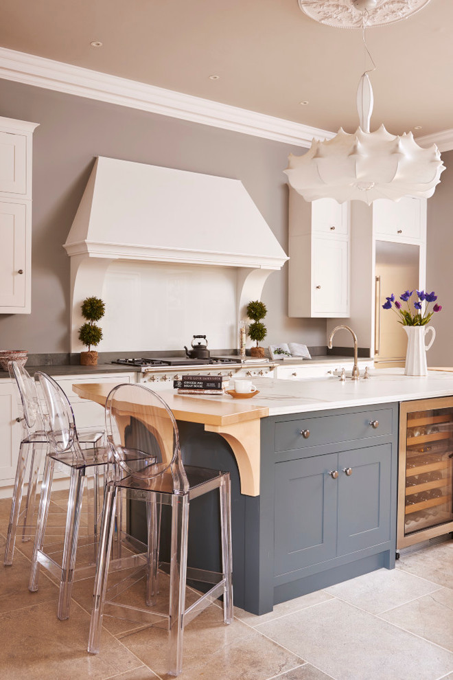 Inspiration for a traditional kitchen in Other with shaker cabinets, white cabinets and an island.