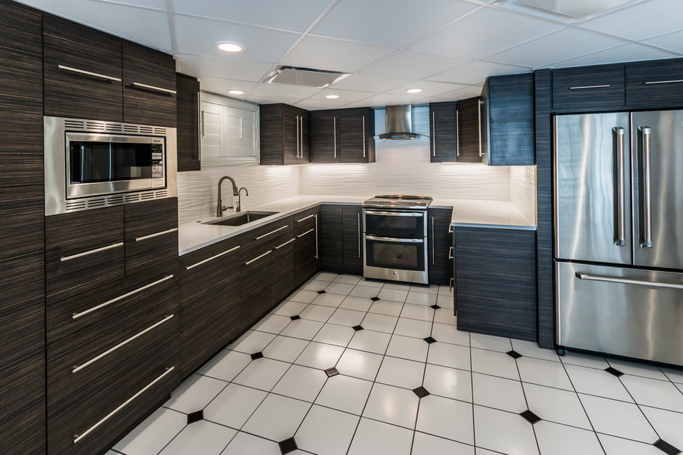 Example of a mid-sized trendy u-shaped ceramic tile eat-in kitchen design in Other with an undermount sink, flat-panel cabinets, dark wood cabinets, quartz countertops, white backsplash, porcelain backsplash, stainless steel appliances and no island