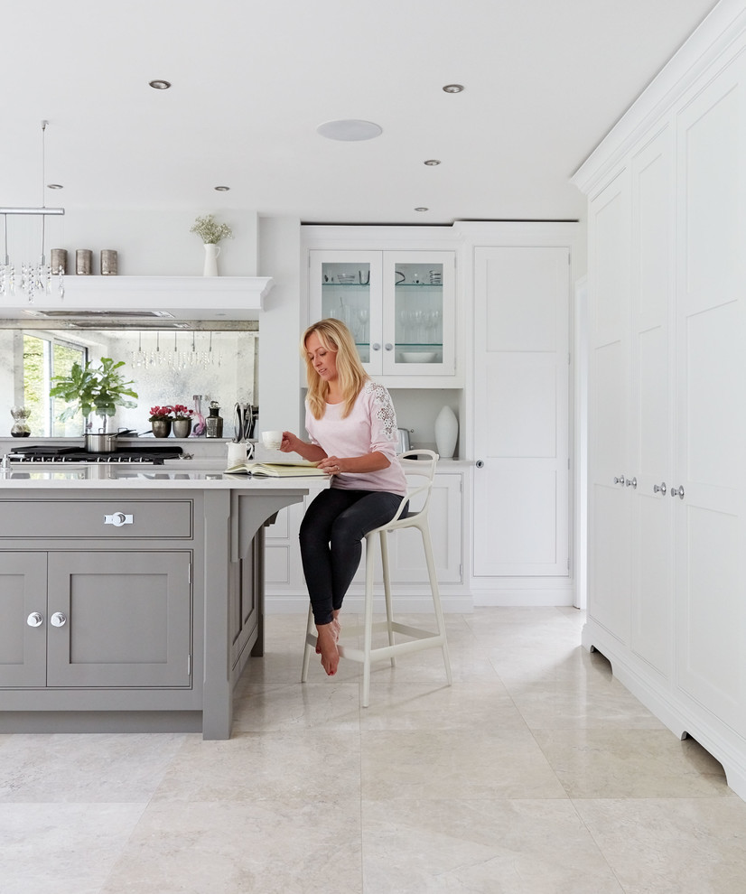 Inspiration for a large contemporary l-shaped kitchen/diner in Manchester with an integrated sink, shaker cabinets, grey cabinets, quartz worktops, metallic splashback, mirror splashback, coloured appliances, marble flooring, an island, beige floors and white worktops.