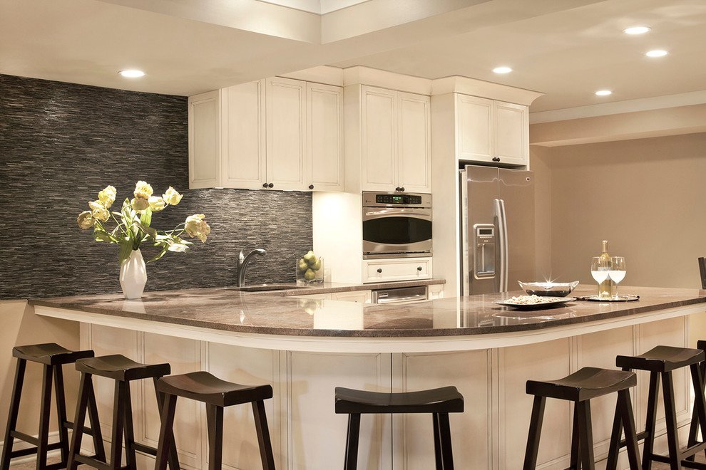 Example of a large trendy u-shaped open concept kitchen design in Other with an undermount sink, recessed-panel cabinets, white cabinets, granite countertops, gray backsplash, matchstick tile backsplash, stainless steel appliances and a peninsula