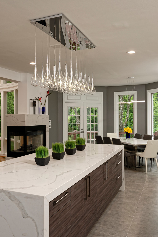 Inspiration for a mid-sized contemporary u-shaped porcelain tile open concept kitchen remodel in DC Metro with a farmhouse sink, flat-panel cabinets, white cabinets, quartz countertops, white backsplash, ceramic backsplash, stainless steel appliances and two islands