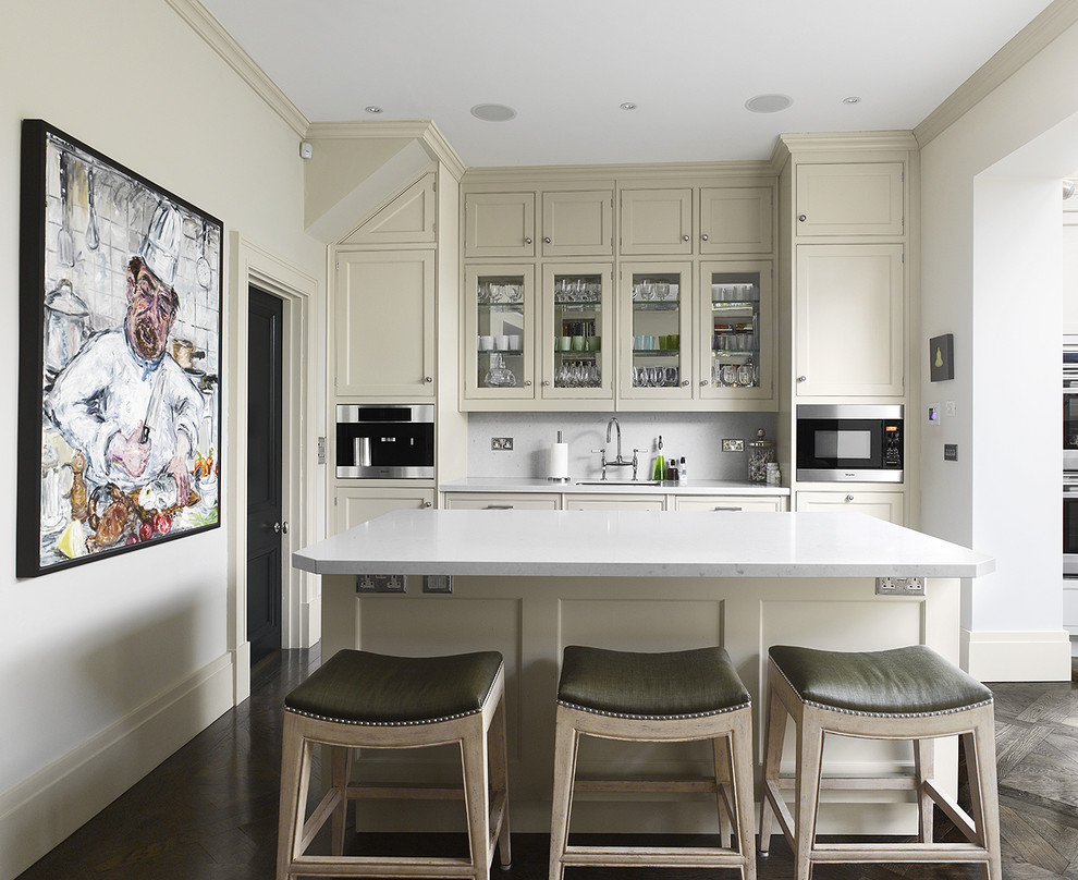 Kitchen - contemporary kitchen idea in Philadelphia with glass-front cabinets and stainless steel appliances