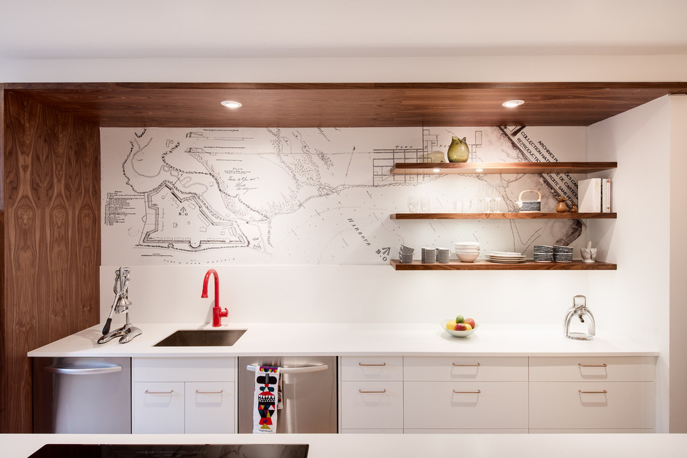 Example of a trendy galley kitchen design in Toronto with flat-panel cabinets, white cabinets, white backsplash, stainless steel appliances and an island