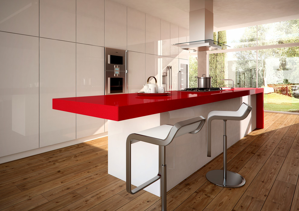 Foto di una cucina design con top in quarzo composito e top rosso
