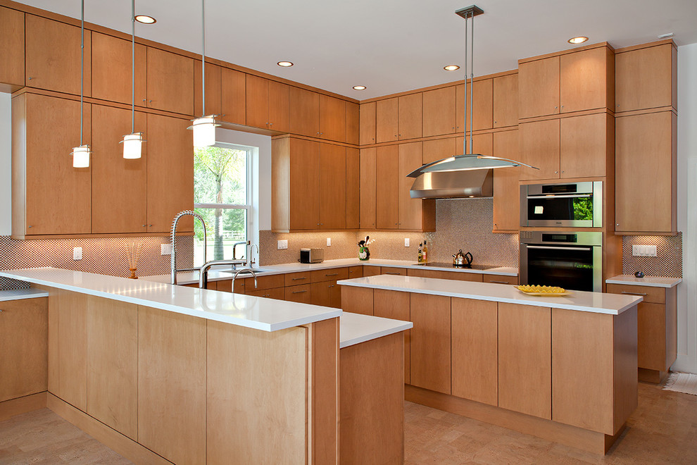 Example of a trendy u-shaped kitchen design in Miami with flat-panel cabinets, medium tone wood cabinets, stainless steel appliances and an island
