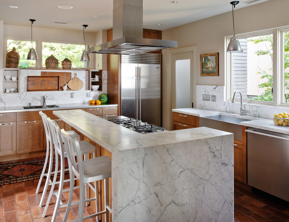 Example of a trendy kitchen design in Seattle with a farmhouse sink, marble countertops and marble backsplash
