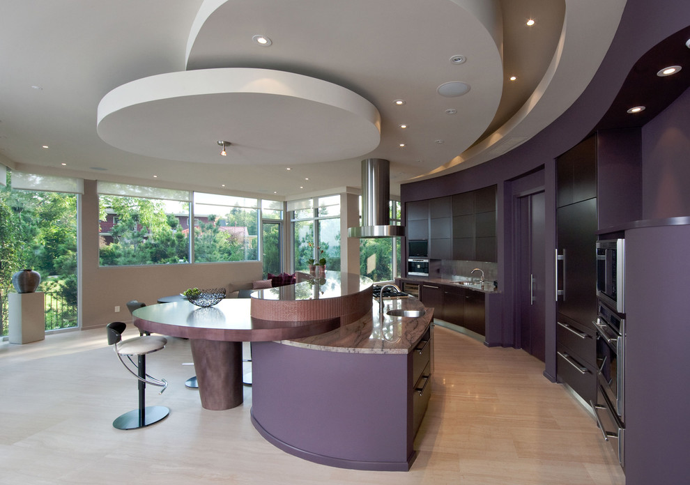 Kitchen - contemporary galley kitchen idea in Toronto with flat-panel cabinets, stainless steel appliances, black cabinets and stone slab backsplash