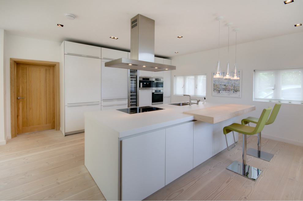 Design ideas for a contemporary kitchen in Gloucestershire with stainless steel appliances.