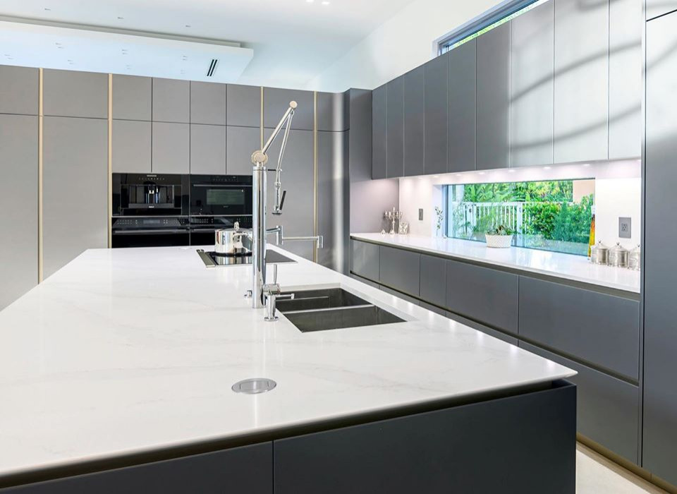 Inspiration for a large contemporary l-shaped kitchen in Miami with flat-panel cabinets, grey cabinets and an island.