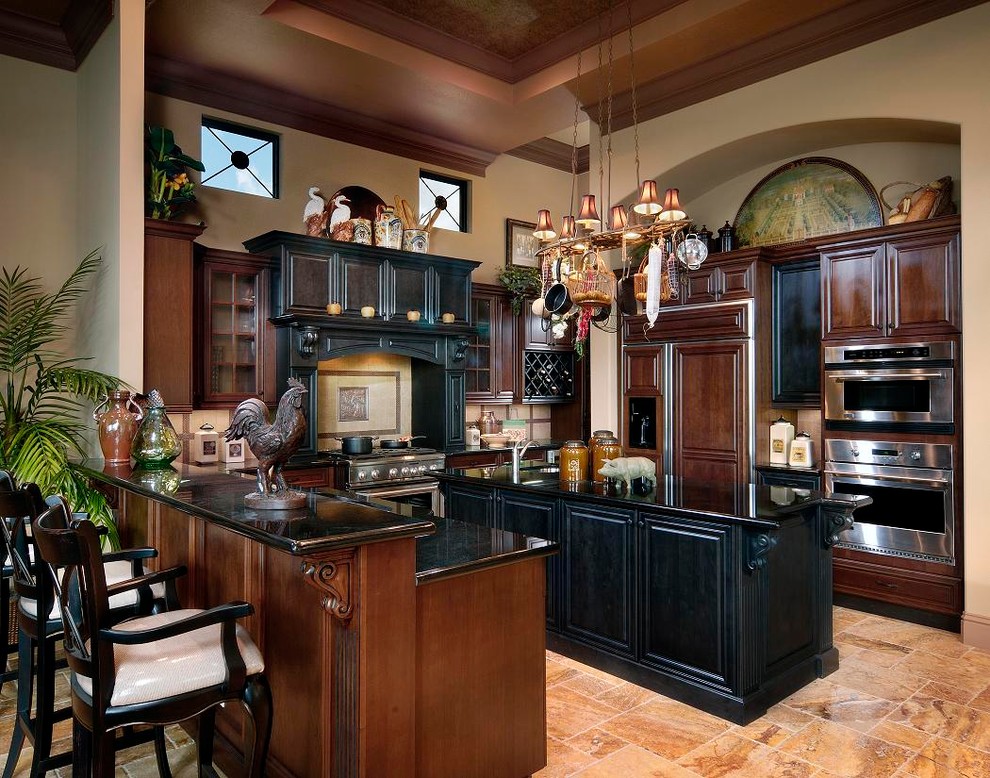 Trendy u-shaped kitchen photo in Miami with raised-panel cabinets, dark wood cabinets and paneled appliances