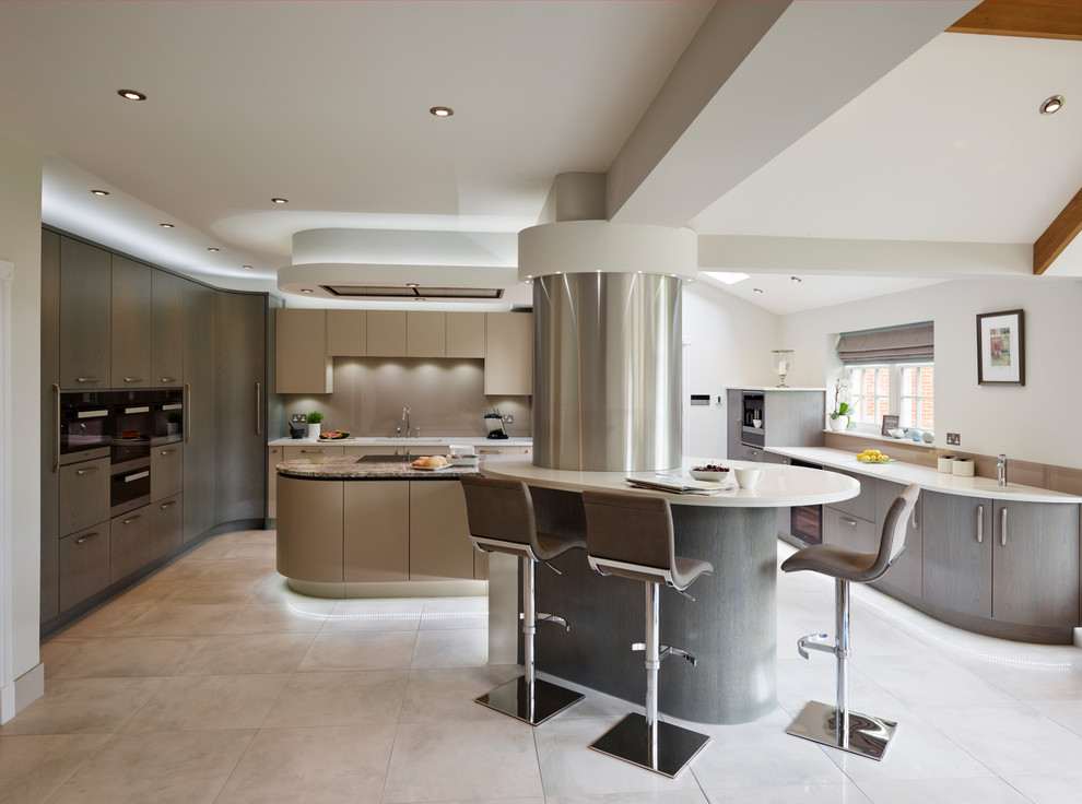 Photo of an expansive contemporary kitchen in Essex with flat-panel cabinets, multiple islands, beige splashback, glass sheet splashback and black appliances.
