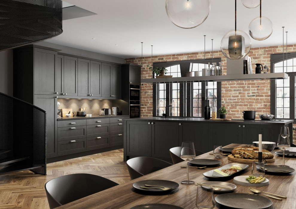 Design ideas for a large contemporary galley open plan kitchen in Other with shaker cabinets, grey cabinets, quartz worktops, grey splashback, light hardwood flooring, an island, brown floors and grey worktops.