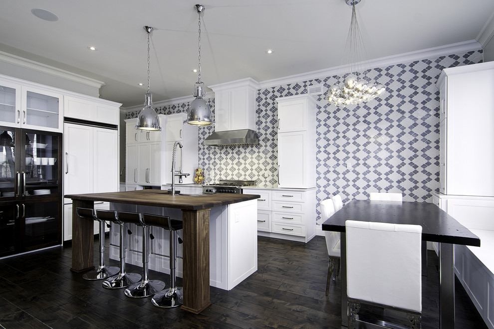 Immagine di una cucina abitabile minimal con top in legno
