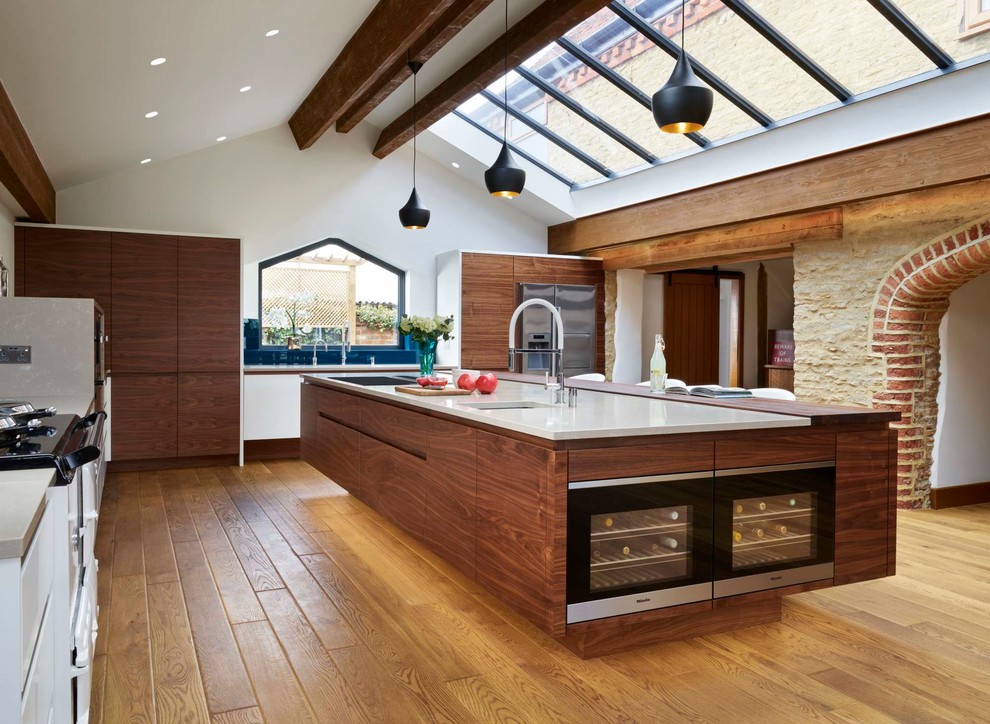 This is an example of a large contemporary kitchen/diner in Buckinghamshire with an island.