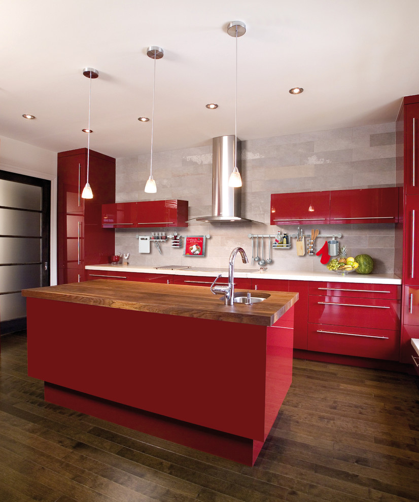 Inspiration for a large contemporary u-shaped kitchen/diner in Raleigh with an integrated sink, flat-panel cabinets, red cabinets, quartz worktops, beige splashback, ceramic splashback, stainless steel appliances, medium hardwood flooring and an island.