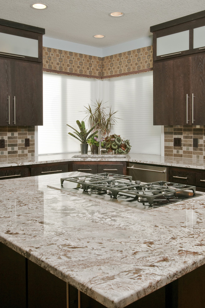 Example of a trendy u-shaped open concept kitchen design in Other with an undermount sink, flat-panel cabinets, dark wood cabinets, granite countertops, multicolored backsplash, mosaic tile backsplash and stainless steel appliances