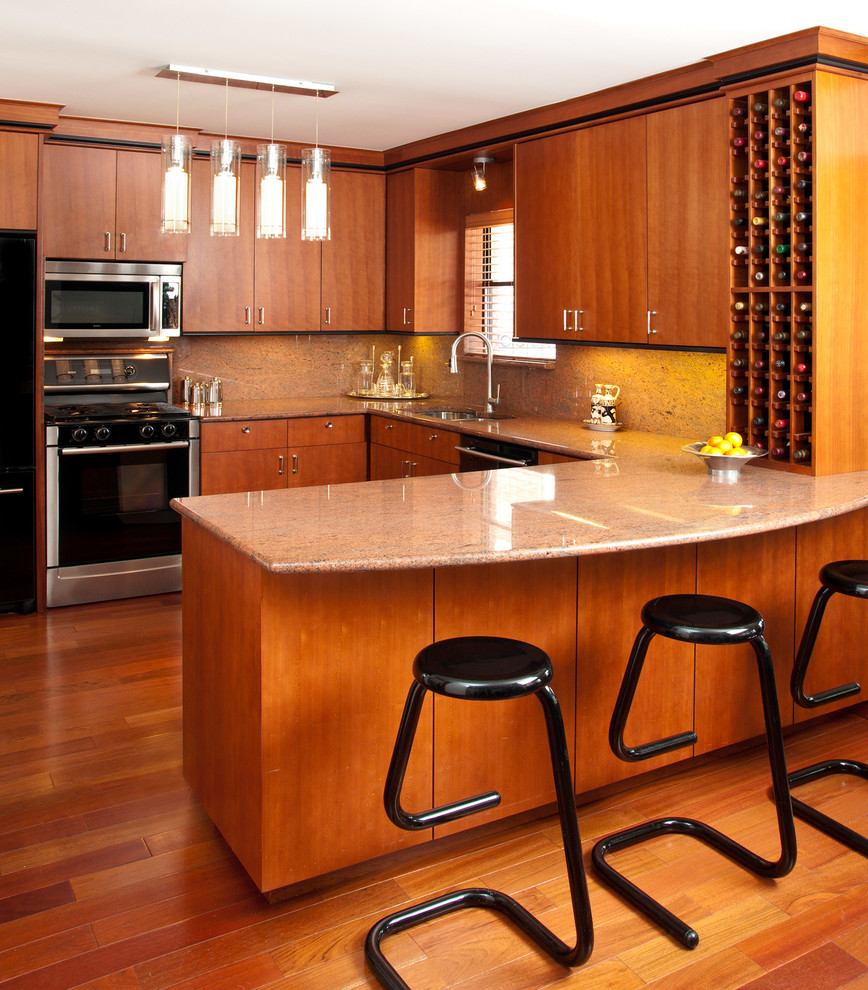 Cette image montre une cuisine design avec un plan de travail en granite.