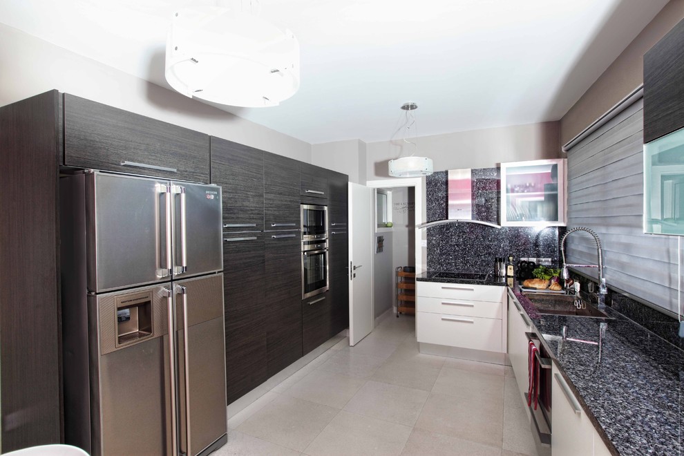 This is an example of a contemporary kitchen in Other with flat-panel cabinets and black cabinets.