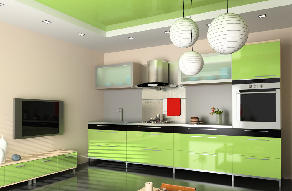This is an example of a small contemporary single-wall open plan kitchen in Other with a submerged sink, flat-panel cabinets, green cabinets, composite countertops, grey splashback, glass sheet splashback, stainless steel appliances, cement flooring, no island and grey floors.