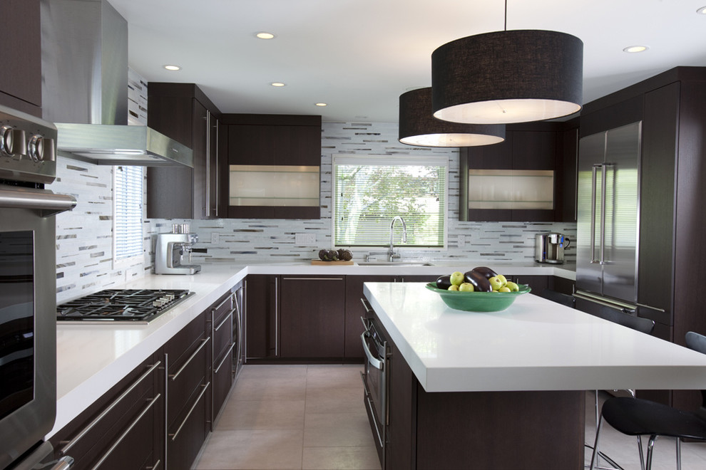 Kitchen - contemporary u-shaped kitchen idea in New York with matchstick tile backsplash, stainless steel appliances, flat-panel cabinets, dark wood cabinets, quartz countertops and multicolored backsplash