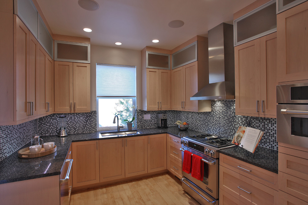 Inspiration for a large contemporary u-shaped light wood floor and brown floor enclosed kitchen remodel in DC Metro with a single-bowl sink, shaker cabinets, light wood cabinets, granite countertops, blue backsplash, mosaic tile backsplash, stainless steel appliances and no island