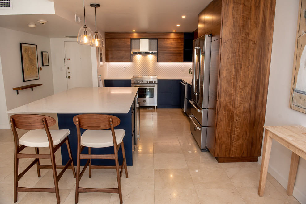 Example of a large trendy l-shaped eat-in kitchen design in Miami with an island